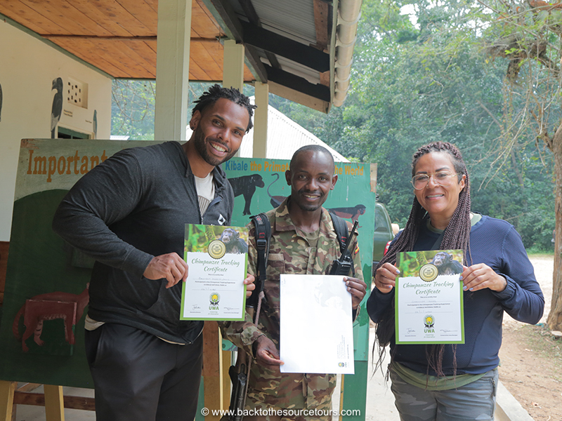 Brenden Durell and Shannon Amos get their certificates for chimp trekking